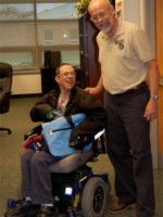A student using a wheelchair and teacher at Edinboro College