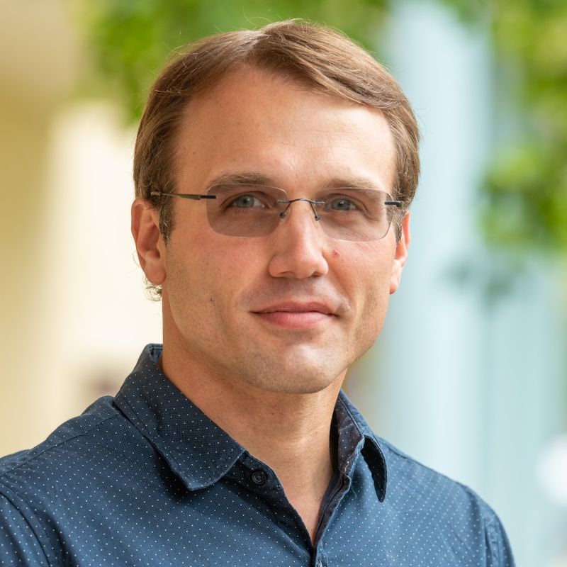 jack dincher, male with light brown hair wearing glasses